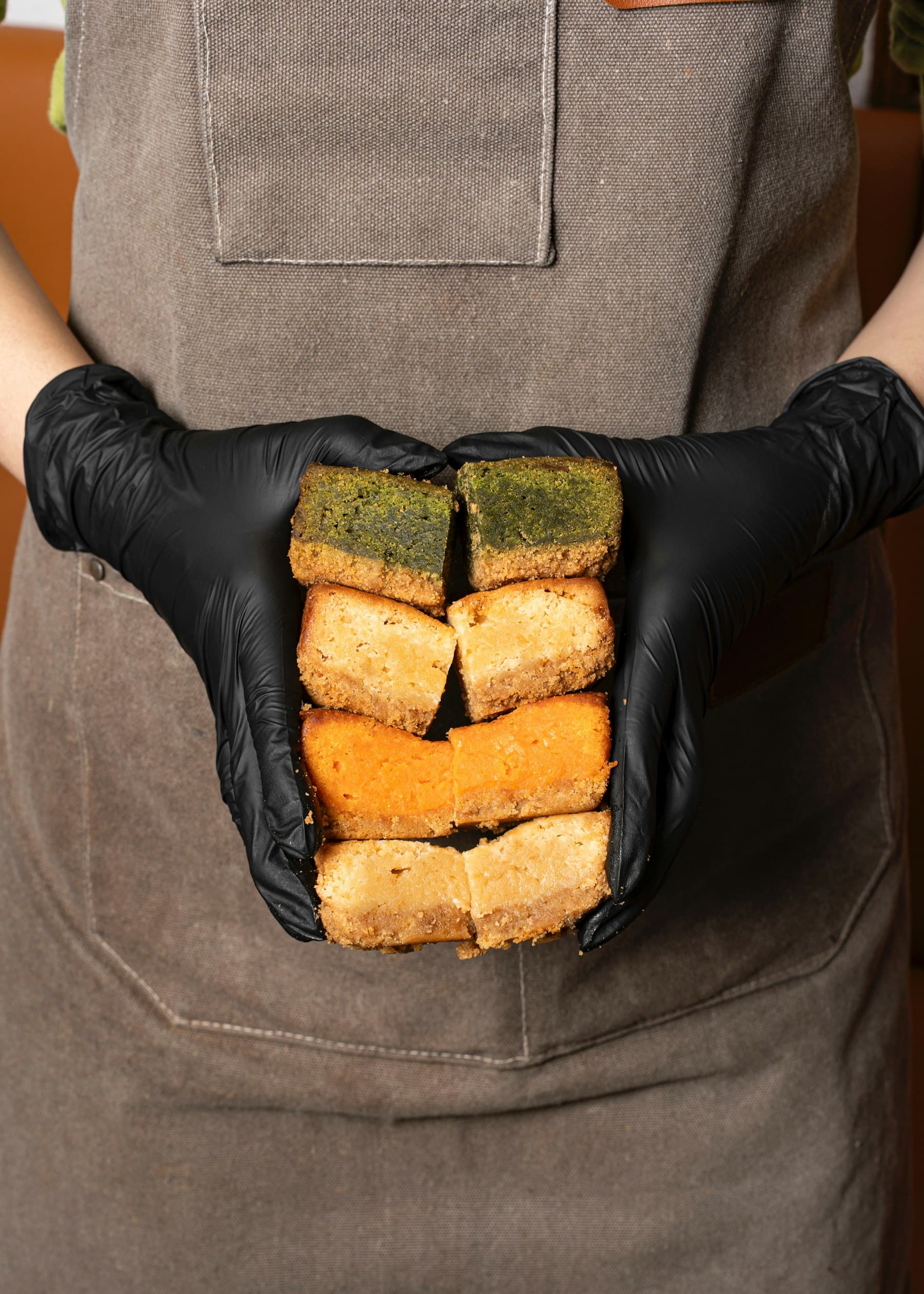 Hands holding cake slices